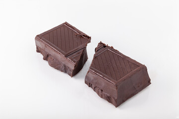Broken Chocolate Bar on White Background
