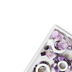 Beautiful purple natural gemstone amethyst on a white background.