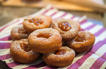 Plate of Fresh Homemade Fried Donuts with jam top view