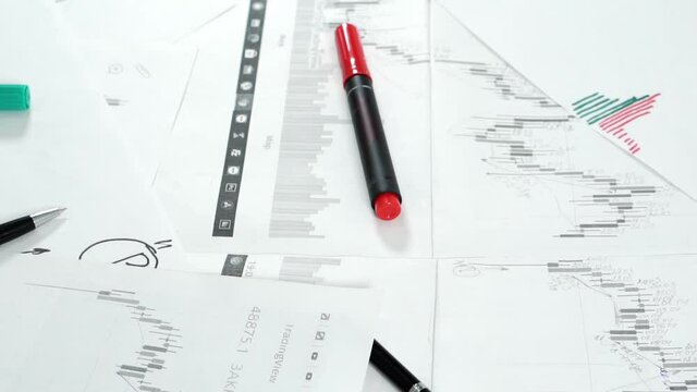 Work desk with papers and stationery.
