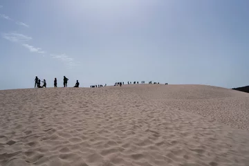 Tuinposter Bolonia strand, Tarifa, Spanje Silueta de gente en dunas de bolonia en playas de cadiz