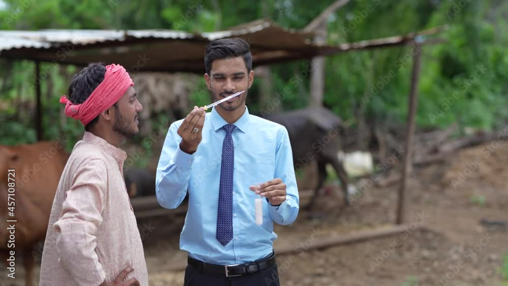 Canvas Prints Indian agronomist or  animal husbandry officer collecting milk sample with farmer at dairy farm 