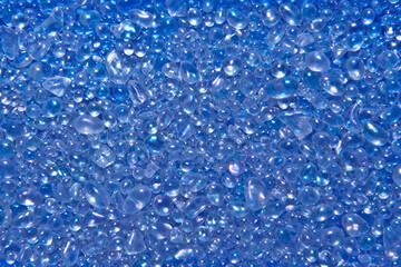 青色のキラキラとしたガラス粒の背景