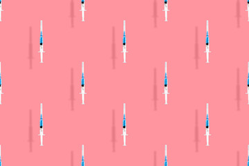 Medical syringes seamless pattern. Background on the theme of medicine, vaccination and human health.