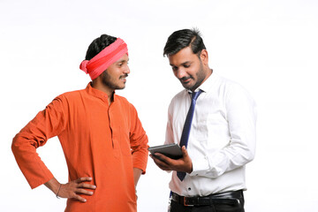 Technology concept : officer showing some detail to farmer in tablet.