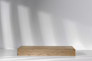 A minimalist pedestal with a blank space and sun shadows on the wall 