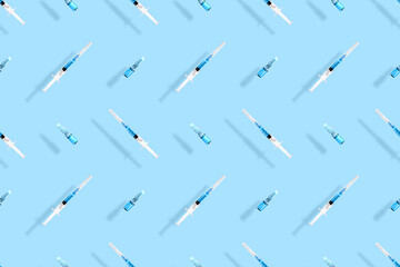 Medical syringes seamless pattern. Background on the theme of medicine, vaccination and human health.