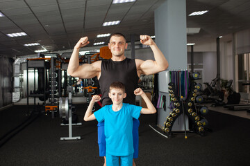 Fototapeta na wymiar Coach and student in gym, training for children of school. Active sports healthy lifestyle, concept. A man and a boy pose, smile, are happy. Physical activity for schoolchildren, treatment of problems