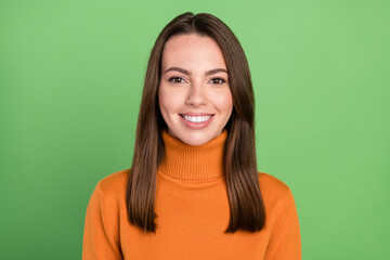 Photo portrait smiling woman wearing orange turtleneck isolated pastel green color background