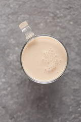 cup with ayran or sour milk on gray background