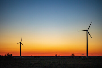 wind turbines at sunset