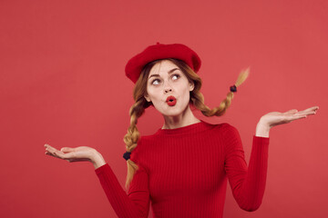 cheerful woman in a red sweater cosmetics emotion studio posing