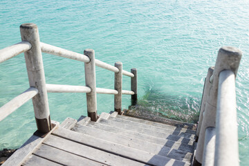 Beautiful tropical steps into turquoise sea water