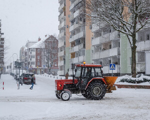 WINTER ATTACK - A road service vehicle fights snow on streets of the city 