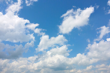 Naklejka na ściany i meble Beautiful view of the blue sky with white clouds, background.