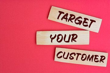 Target Your Customer Text on Wooden Blocks on red Background