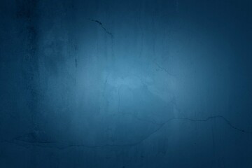 Old blue wall in spots, cracks, stains. Painted concrete wall in abstract grunge style loft. Vintage wall background texture for backgrounds, portraits, posters.