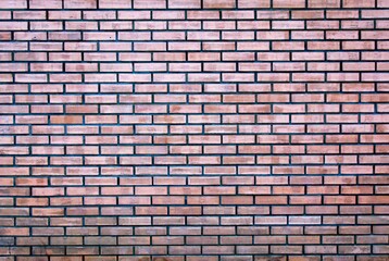 Weathered stained old brown brick wall background