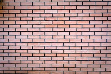 Weathered stained old brown brick wall background