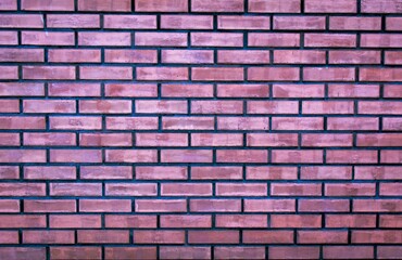 Weathered stained old purple brick wall background