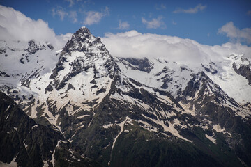 Sharp Peaks of Mountain Ridge under Snow. Close Up View