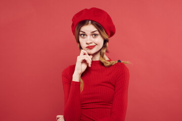 cheerful woman with a red cap on his head glamor isolated background