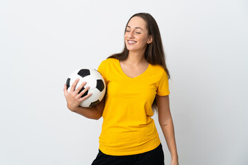 Young football player woman over isolated white background looking to the side and smiling