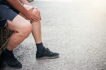 Senior man suffering from arthritis in his knee