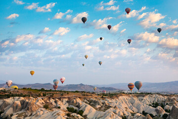 Cappadocia, Turkey - September 1, 2021 - Cappadocia Panoramic - Hot air balloon flying in early...