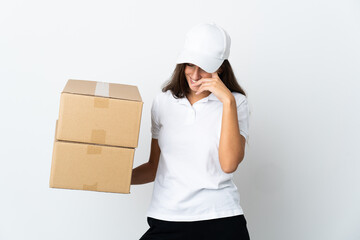 Young delivery woman over isolated white background laughing