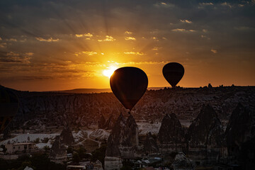 Cappadocia, Turkey - September 1, 2021 - Cappadocia Panoramic - Hot air balloon flying in early...