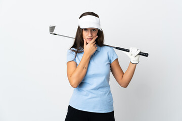 Young golfer woman over isolated white background thinking