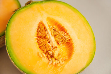 A half fresh melon was cut for show inside of it, consist a lot of seed.