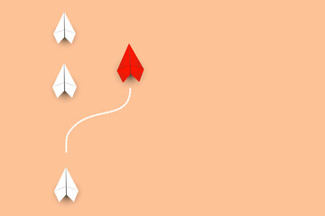 white rocket paper cut on a warm orange background Idea competition ideas and marketing ideas. The triumph of those who think differently