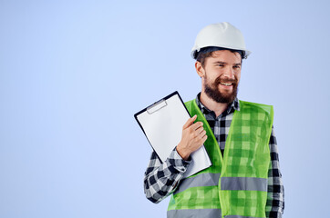 male builder in a green vestconstruction work design blue background
