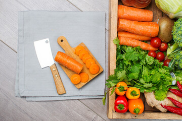 Fresh vegetables ready for cooking shot on a gray kitchen table