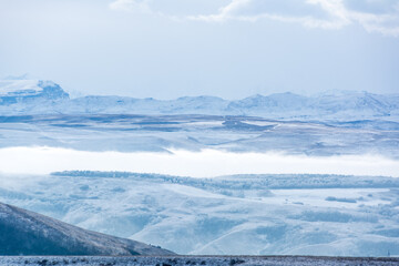 Kislovodsk, Russia. December 28, 2018. Majestic mountain peaks in the fog.