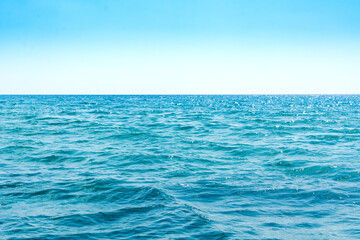 Russia, Crimea, Feodosia, Primorsky village, August 20, 2020. Bright blue waves of the Black Sea.