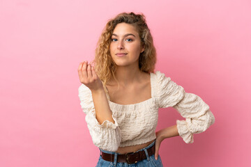 Young blonde woman isolated on pink background making Italian gesture