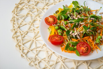 Healthy veggie salad with apple, green herbs, bell paper, seeds and carrots - low carbohydrate, low calorie diet. Healthy eating, nutrition and diet concept. Top view, flat lay
