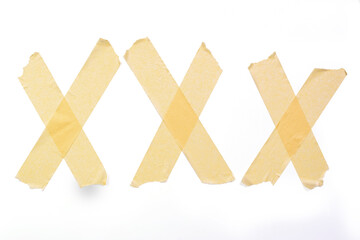 Three X made of adhesive tape on white background, with cliping path