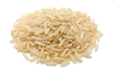 close up of uncooked long brown rice isolated on white