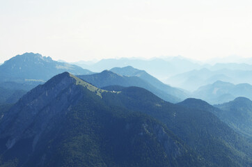 Naklejka premium GERMANY, MUNCHEN: Scenic landscape aerial view of Bavarian Alp mountains with lake in the valley 