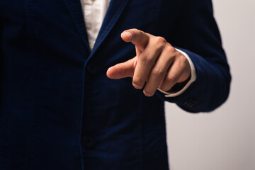 Businessman hand pointing or touching empty virtual screen.