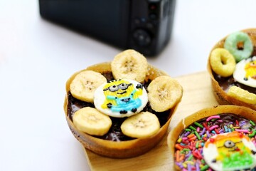 Martabak Mini or Martabak Mini Bangka with various Topping. The martabak mini bangka is made from a mixture of flour, eggs, sugar, baking soda, coconut milk and water.