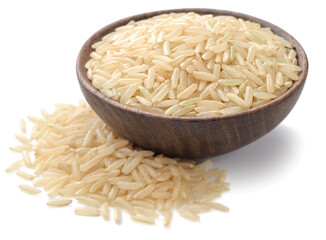 uncooked brown rice in the wooden bowl, isolated on the white background
