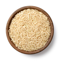 uncooked brown rice in the wooden bowl, isolated on the white background, top view
