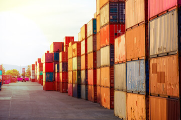 Fototapeta premium Freight, transportation, transportation, transportation, delivery and distribution. commercial business ideas Group of 40-foot heavy-duty colored metal containers stacked in the wharf.