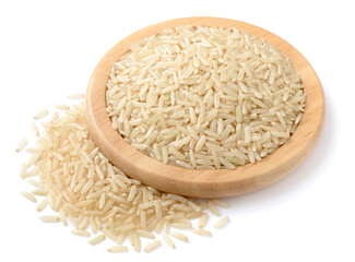 raw long brown rice in the wooden plate, isolated on the white background