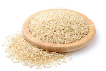 raw long brown rice in the wooden plate, isolated on the white background